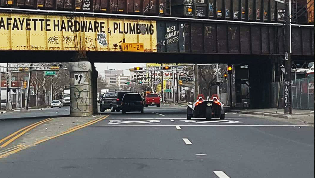 Street view beneath railroad bridge in Newark, NJ